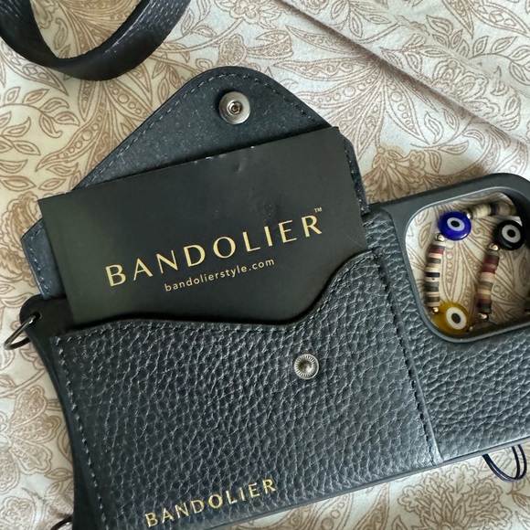 Bandolier case for iPhone crossbody case and AirPods case.